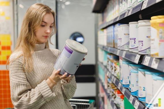 Mother choosing baby formula in super market