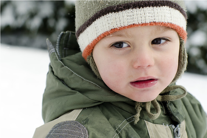 Baby fully covered in winter. 